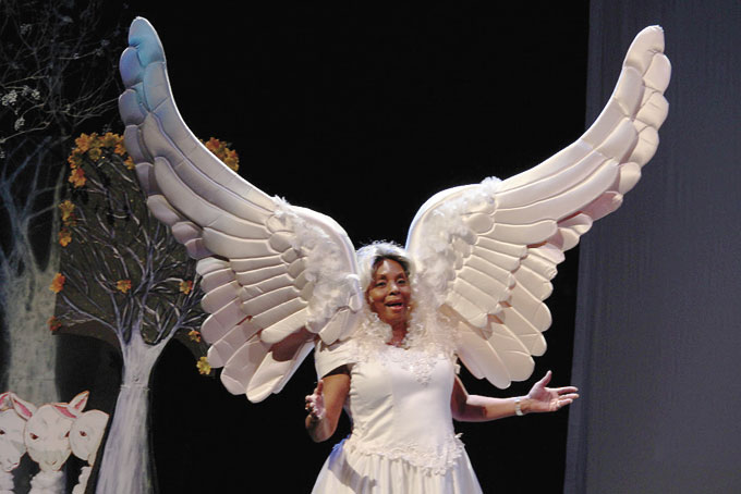 AN ANGEL—Carolyn Pittman singing “Angels We Have Heard On High.”