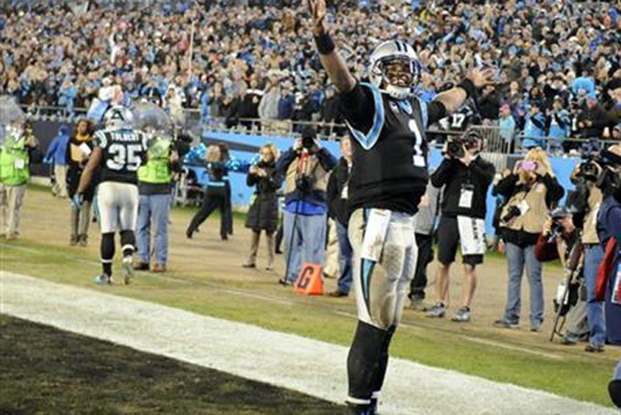 Carolina Panthers quarterback Cam Newton (1) celebrates a touchdown pass against the Tampa Bay Buccaneers in the second half of an NFL football game in Charlotte, N.C., Sunday, Jan. 3, 2016. (AP Photo/Mike McCarn)