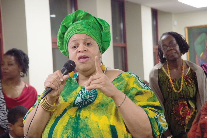 CELETA HICKMAN, founder of the Ujamaa Collective, greets the community at Ujamaa Collective’s Kwanzaa celebration.