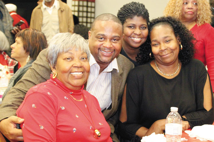 ENJOYING THE EVENING—Rep. Ed Gainey with Mary Hill (in the red) and friends.