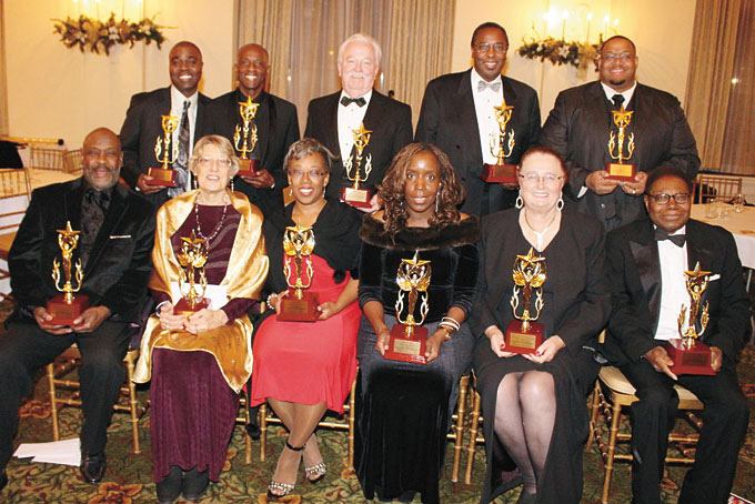 HUMANITARIAN AWARD WINNERS—A few of the evening’s 20 honorees. Sitting, from left: Ralph Watson, Ann Mason, Sonya Toler, Dr. Dawndra Jones, Pamela Macklin and Rev. Dr. Alfred Brown. Standing, from left: Nathaniel K. Goodson, Charles Allie, James B. O’Brien, Dr. William Simmons and Mayor Dwan B. Walker. (Photo by J.L. Martello) 