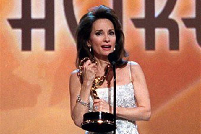 In this May 21, 1999 file photo, a triumphant Susan Lucci holds the Daytime Emmy statue she waited nineteen years to receive during the Daytime Emmy Awards in New York. Lucci won for Best Actress in a Drama Series. (AP Photo/Ben Luzon, File)