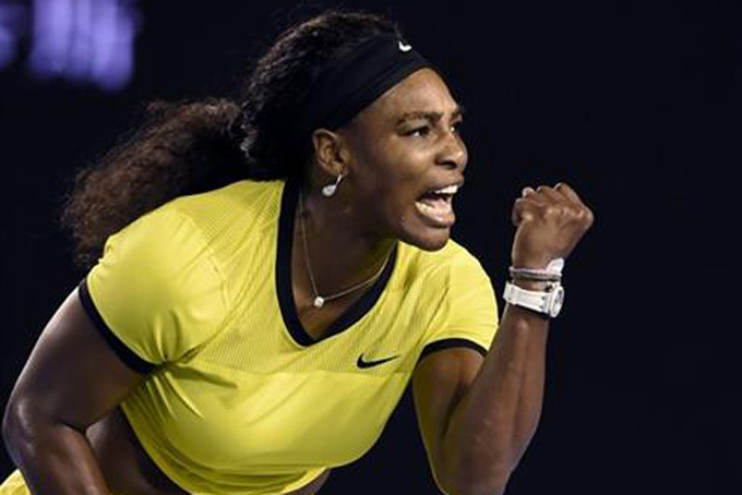 Serena Williams of the United States celebrates after winning a point against Agnieszka Radwanska of Poland during their semifinal match at the Australian Open tennis championships in Melbourne, Australia, Thursday, Jan. 28, 2016.(AP Photo/Andrew Brownbill)