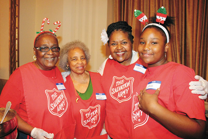 VOLUNTEERS—Wilma Griffin, Kitty Maban, Teri Bridgett and J’ona Dozier are just some of the volun- teers who came out to help serve Christmas dinners.
