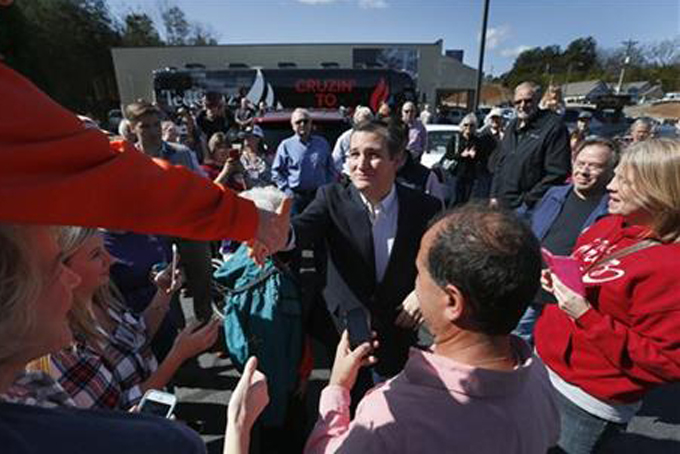 Republican presidential candidate, Sen. Ted Cruz, R-Texas greets supporters at the Seneca Family Restaurant, Tuesday, Feb. 16, 2016, in Seneca, S.C. (AP Photo/Paul Sancya)