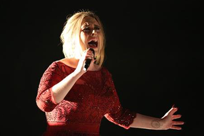 Adele performs at the 58th annual Grammy Awards on Monday, Feb. 15, 2016, in Los Angeles. (Photo by Matt Sayles/Invision/AP)