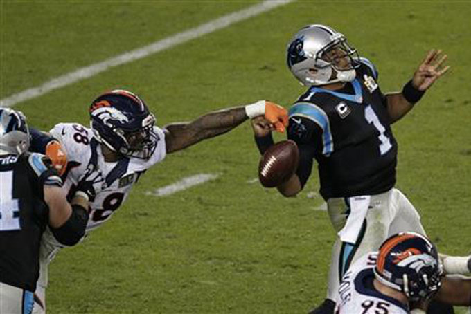 Denver Broncos’ Von Miller (58) strips the ball from Carolina Panthers’ Cam Newton (1) during the second half of the NFL Super Bowl 50 football game Sunday, Feb. 7, 2016, in Santa Clara, Calif. (AP Photo/Charlie Riedel)