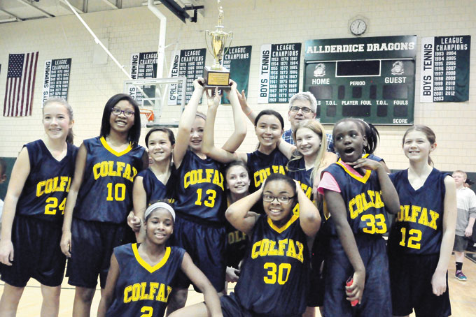 GIRLS CHAMPIONS CELEBRATE—The Colfax Girls won their second straight City League Middle School Championship with a 40-32 overtime win over Obama Academy. (Photos by William McBride) 