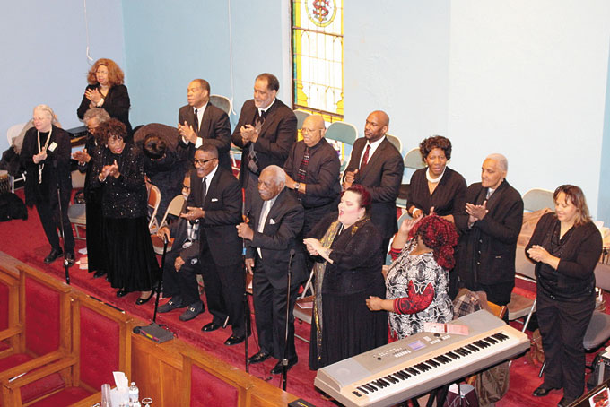 COMBINED CHOIR—The Urban League of Greater Pittsburgh hosted its Urban League Sunday at Wesley Center AMEZ Church, located at 2701 Centre Ave., in the Hill District. The evening’s special guests were Rev. B. DeNeice Welch of Bidwell Presbyterian Church and the Pittsburgh Combined Male Choir, under the direction of Rev. Deryck Tines. Pictured above, the Pittsburgh Combined Mass Choir singing one of its several selections. (Photos by J.L. Martello) 