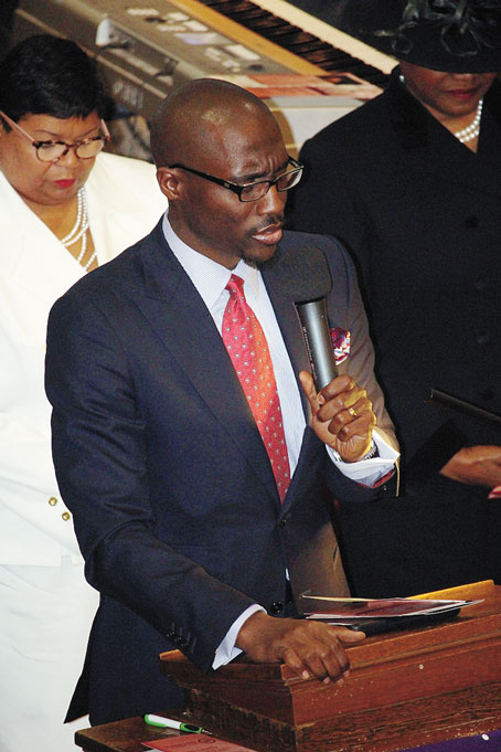 REV. CHRISTOPHER THOMPSON, pastor of Hillcrest Seventh-Day Adventist Church, giving the benediction. 
