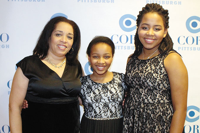 FAMILY SUPPORT—Barbara Griffin, Kira Mukogosi, and honoree Joan Mukogosi.