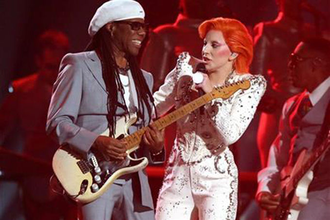 Nile Rodgers, left, and Lady Gaga perform a tribute to David Bowie at the 58th annual Grammy Awards on Monday, Feb. 15, 2016, in Los Angeles. (Photo by Matt Sayles/Invision/AP)