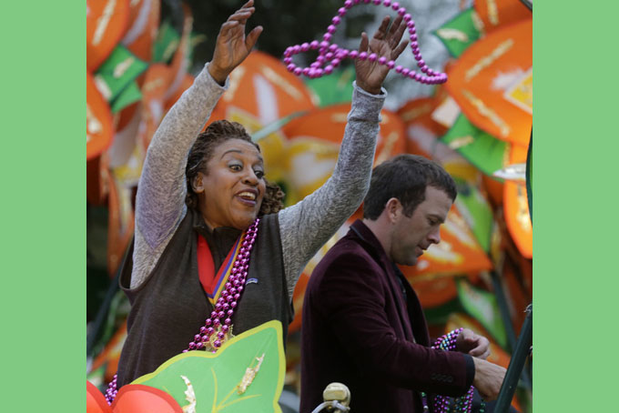CCH Pounder, actress on the television series NCIS New Orleans, throws beads from a float during the Krewe of Proteus parade in New Orleans, Monday, Feb. 16, 2015. The day is known as Lundi Gras, the day before Mardi Gras. (AP Photo/Gerald Herbert)
