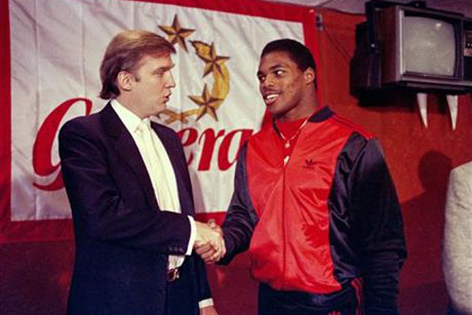 FILE - In this March 8, 1984, file photo, Donald Trump shakes hands with Herschel Walker in New York after agreement on a 4-year contract with the New Jersey Generals USFL football team. The New Jersey Generals have been largely forgotten, but Trump’s ownership of the team was formative in his evolution as a public figure and peerless self-publicist. With money and swagger, he led a shaky and relatively low-budget spring football league, the USFL, into a showdown with the NFL. (AP Photo/Dave Pickoff, File)