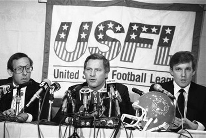 FILE - In this Aug. 2, 1985, file photo, Donald Trump, right, New York real estate magnates Stephen Ross, left, and USFL Commissioner Harry L. Usher, center, participate in a news conference in New York to discuss the agreement they have reached in principle to merge the Houston Gamblers and New Jersey Generals football franchises. The New Jersey Generals have been largely forgotten, but Trump’s ownership of the team was formative in his evolution as a public figure and peerless self-publicist. With money and swagger, he led a shaky and relatively low-budget spring football league, the USFL, into a showdown with the NFL. (AP Photo/Marty Lederhandler, File)