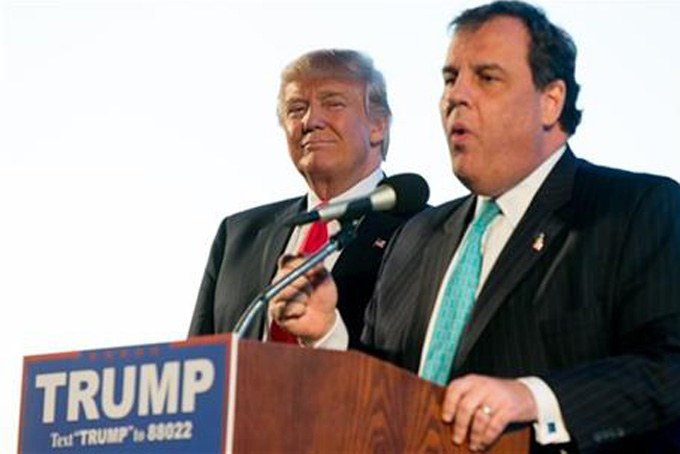 New Jersey Gov. Chris Christie, right, introduces Republican presidential candidate Donald Trump, left, at a rally at Millington Regional Airport in Millington, Tenn., Saturday, Feb. 27, 2016. (AP Photo/Andrew Harnik)