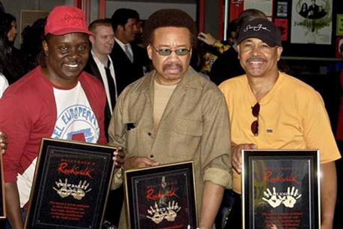  In this July 7, 2003 file photo, Philip Bailey, from left, Maurice White, and Ralph Johnson, of Earth Wind & Fire hold up the plaques from their induction at the Hollywood Rock Walk at a ceremony in Los Angeles. White, the founder and leader of Earth, Wind & Fire, died at home in Los Angeles, Wednesday, Feb. 3, 2016, said his brother, Verdine White. He was 74. (AP Photo/Matt Sayles, File)