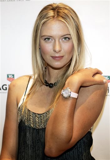  In this Aug. 23, 2005, file photo, Maria Sharapova poses for photographers as she launches a new watch for TAG Heuer in New York. (AP Photo/Jeff Christensen, File) 