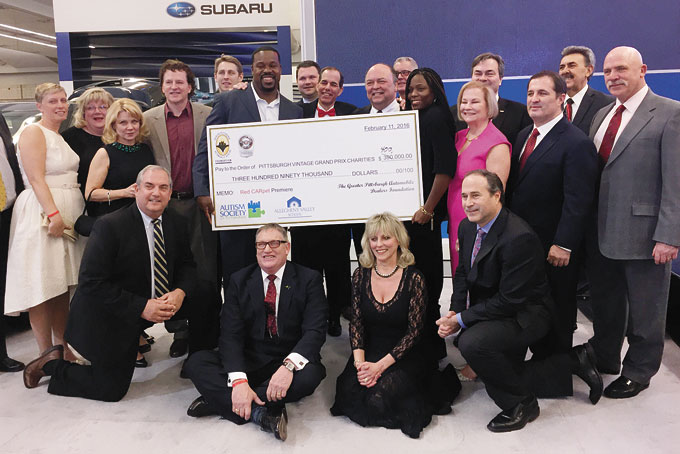 BIG CHECK—The Red CARpet Premiere’s Pittsburgh Charity event raised $400,000 to fight Autism. (Photos by Paige Mitchell)