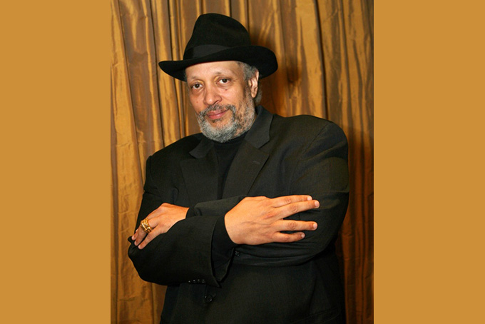In this Oct. 6, 2006 file photo, author Walter Mosely poses at Lincoln Center in New York. The wave of police killings that helped launch the Black Lives Matter movement is also influencing a genre that captured tensions between police and non-white communities. Mosley, best known for "Devil in the Blue Dress" and other novels featuring black detective Easy Rawlins, says he has been working on a book about a former New York City policeman investigating the shooting of two officers by a black man and learning that the officers had tried to kill the man first. (AP Photo/Rick Maiman, File)