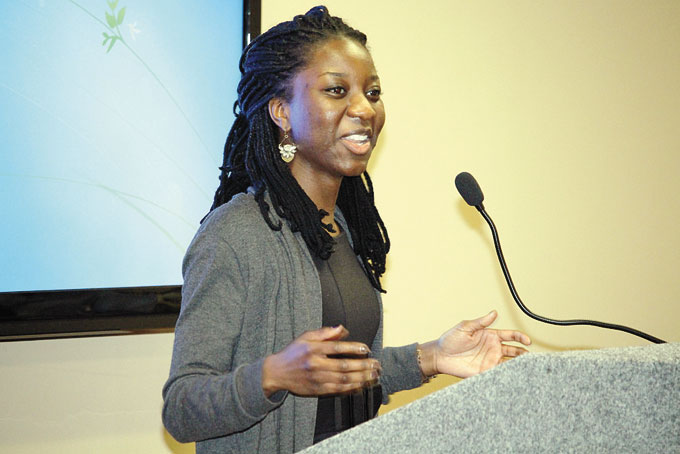 CANDACE OKELLO giving her presentation African father, African American mother.
