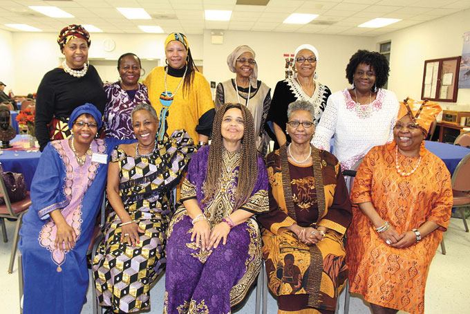GRANDMOTHERS IN AFRICAN DRESS—Grandmothers of Pearls hosted its Monthly Gathering at the Homewood Center, Homewood. To attend, one had to be a grandmother or greater and wear a pearl necklace—real or costume. If they didn’t own pearls a set was loaned to them. The afternoon included entertainment, informational and inspirational speakers, and entertainment. Guests were asked to wear African garb in observance of Black History Month. Above grandmothers in African dress are from left: sitting are Donna Bundy Ford, Sandra Bundy Simmons, Joann Scott Falls, Trish Wilds, Renee Russell. Standing from left: Valarie Council-Thompson, Eline Jenkins, Christine Pennybaker-Douglas, Lillie Hill, Jean Simmons Morris and Maria Nolden. (Photos by J.L. Martello)