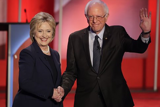 Democratic presidential candidate, Hillary Clinton and Democratic presidential candidate, Sen. Bernie Sanders, I-Vt, shakes hands as they greet the audience before the audience before a Democratic presidential primary debate hosted by MSNBC at the University of New Hampshire Thursday, Feb. 4, 2016, in Durham, N.H. (AP Photo/David Goldman)