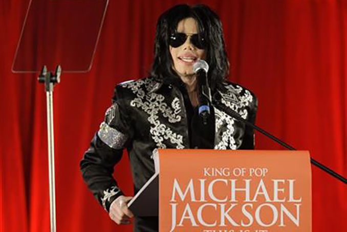 FILE - In this March 5, 2009 file photo, US singer Michael Jackson announces that he is set to play ten live concerts at the London O2 Arena in July, which he announced at a press conference at the London O2 Arena. Jackson and Sony Corp. announced Monday, March 14, 2016, that the singer's estate had sold its half interest in the massive Sony/ATV Music Publishing catalog to the company for $750 million. The catalog includes music by The Beatles, Bob Dylan and other stars, but the deal does not include rights to Jackson's master recordings or songs he wrote. (AP Photo/Joel Ryan, File)