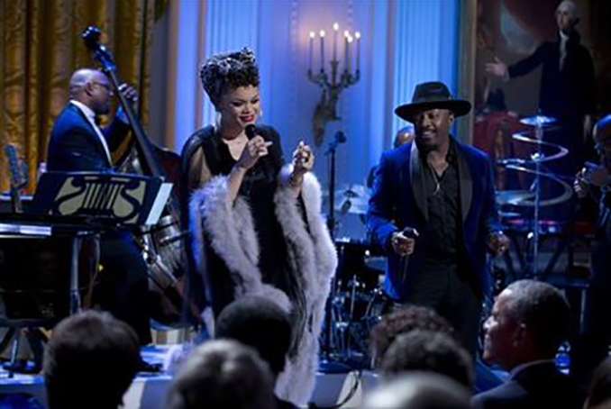 FILE - In this Feb. 24, 2016 file photo, Andra Day and Anthony Hamilton perform for President Barack Obama, front row, lower right, and others during the “In Performance at the White House” series in the East Room of the White House, in Washington. President Barack Obama and first lady Michelle plan to host a blockbuster concert April 29 with established stars and up-and-coming musical artists. The show is to be televised by ABC the following day, on April 30, the fifth anniversary of International Jazz Day. (AP Photo/Carolyn Kaster, File)