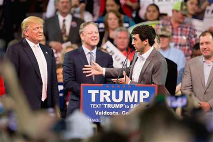 FILE - In this Feb. 29, 2016 file photo, NASCAR Driver Chase Elliott, accompanied by Republican presidential candidate Donald Trump, left, and NASCAR Chairman and CEO Brian France, second from left, speaks at a Trump rally at Valdosta State University in Valdosta, Ga. France’s decision to personally endorse GOP front-runner Donald Trump has roiled a sport his family built from the ground up, threatening to undo a decade of work to broaden the its appeal among minorities and risking a break with the corporate sponsors that are its financial lifeblood. (AP Photo/Andrew Harnik, File)