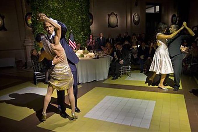 President Barack Obama and first lady Michelle Obama, right, dance the tango with tango dancers during the State Dinner at the Centro Cultural Kirchner, Wednesday, March 23, 2016, in Buenos Aires, Argentina. (AP Photo/Pablo Martinez Monsivais)