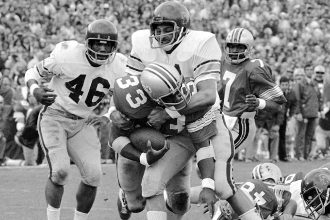 In this Jan. 1, 1973, file photo, Ohio State’s Pete Johnson, is tackled by Southern California’s Gary Jeter during a college football game at the Rose Bowl in Pasadena, Calif. (File/Associated Press)
