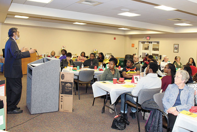 PACKED HOUSE—Ulish Carter, managing editor of the New Pittsburgh Courier was the keynote speaker at the North Hills Ebony Women annual Black History Month celebration. Carter spoke on the history of the Courier and its current goals and objectives. There were two other speakers after Carter who spoke on the history of the Hill District and living in the Hill, and another on what it is like living with African and African American parents. Carol Grove is the president of the group, and Janice Simmons is the Social Committee Chair. Above: Ulish Carter speaks to audience at LaRoche College. (Photos by J.L. Martello) 
