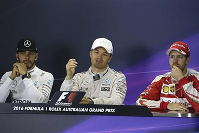 From left, Mercedes driver Lewis Hamilton of Britain, teammate Nico Rosberg of Germany and Ferrari driver Sebastian Vettel of Germany speak at a post race press conference after the Australian Formula One Grand Prix at Albert Park in Melbourne, Australia, Sunday, March 20, 2016. Rosberg beat Hamilton in the season-opening race and Vettel finished third. (AP Photo/Rob Griffith)