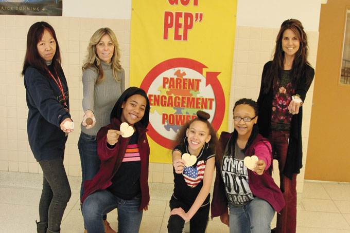 SOME OF THE PARTICIPANTS—Linton Middle School. From left: Standing Kyoko Henson, school social worker; Gloria Peterman,6th grade teacher; Kate Friend, principal. Kneeling, from left: Taylor Shealey, Drew Hines, Lyric Carter. (Photos by Jackie McDonald)