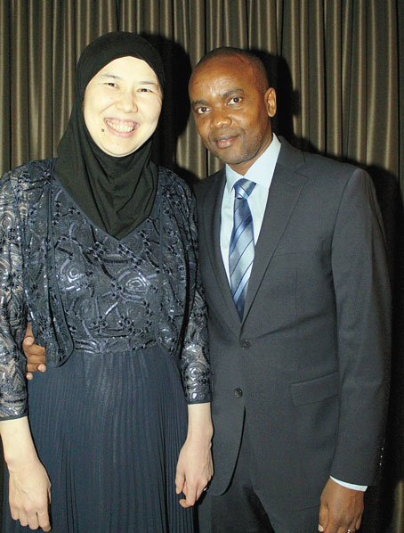 SPOUSE SUPPORT—Wife Raihan Izimdetova with honoree Kheir Mugwaneza.