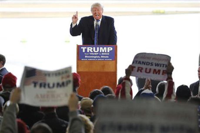 Republican presidential candidate Donald Trump addresses the crowd during a rally Sunday, March 13, 2016, in Bloomington, Ill. (AP Photo/Charles Rex Arbogast)
