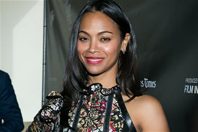 FILE - In this June 14, 2015 file photo, Zoe Saldana attends the Los Angeles Premiere of "Infinitely Polar Bear" held at Regal Cinemas L.A. LIVE in Los Angeles. After many delays, the Nina Simone biopic starring Saldana and David Oyelowo will be simultaneously released in theaters, digital HD and video-on-demand next month. Distributor RLJ Entertainment said Tuesday, March 1, 2016, it will release “Nina” in all formats on April 22. (Photo by John Salangsang/Invision/AP, File)