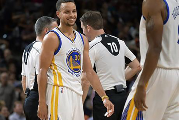 Golden State Warriors guard Stephen Curry (30) smiles during the second half of an NBA basketball game against the San Antonio Spurs, Sunday, April 10, 2016, in San Antonio. Golden State won 92-86. (AP Photo/Darren Abate)