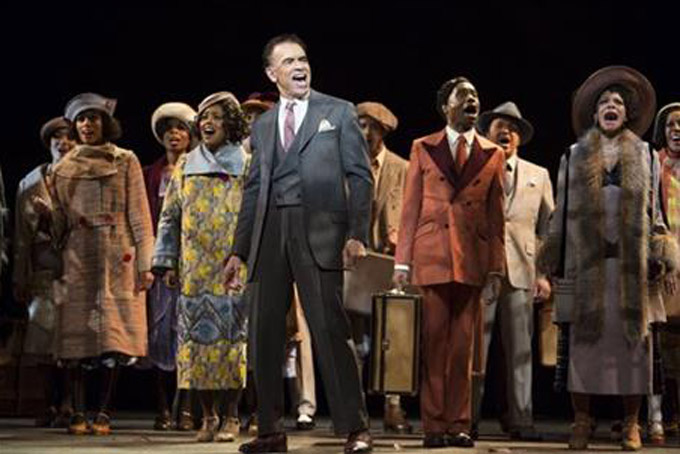 This image released by Philip Rinaldi Publicity shows Brian Stokes Mitchell, center, with the cast during a performance of "Shuffle Along, Or the Making of the Musical Sensation of 1921 and All That Followed" at The Music Box Theatre in New York. (Julieta Cervantes/Philip Rinaldi Publicity via AP)