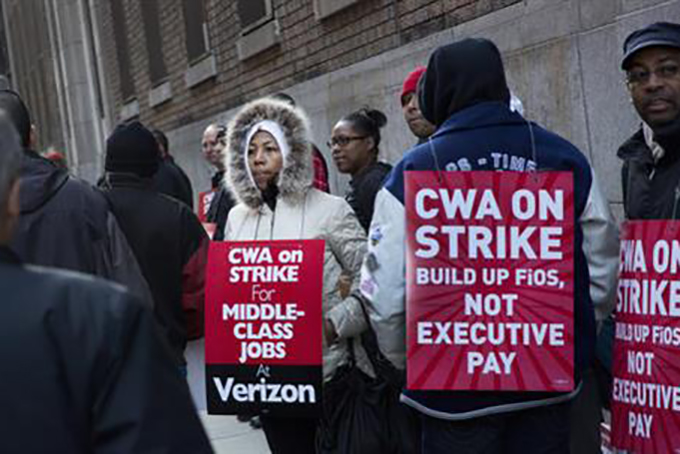 Verizon workers picket in front of a company facility, Wednesday, April 13, 2016, in New York. Tens of thousands of Verizon landline and cable workers on the East Coast walked off the job Wednesday morning after little progress in negotiations since their contract expired nearly eight months ago. (AP Photo/Mark Lennihan)