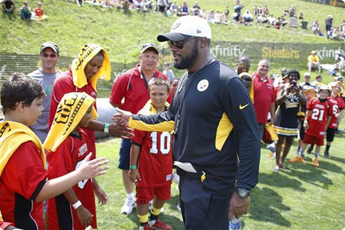 The Associated Press | Pittsburgh Steelers head coach Mike Tomlin greets some of the youth football players attending the first session of practice at NFL football training camp in Latrobe, Pa. on Sunday, July 26, 2015 . (AP Photo/Keith Srakocic) - See more at: https://www.readingeagle.com/ap/article/steelers-celebrate-50th-year-at-st-vincent-college#sthash.pyKcCueX.dpuf