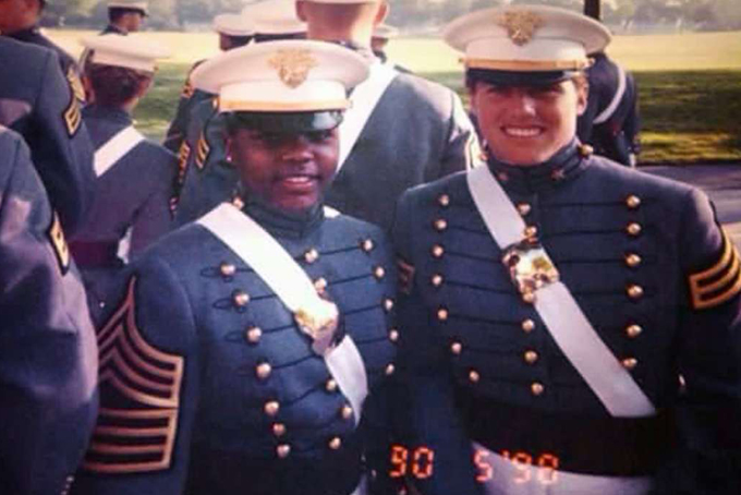 In this 1998 family photo provided by Sakima Brown, left, and her roommate Amy Thomas pose for a photo on their graduation day as cadets at West Point, in Hyde Park, N.Y. Self-expression is hardly a part of life for cadets at the United States Military Academy at West Point. There were just nine black women in her class, and she says that to make it at West Point meant to "shrink your blackness." (Dazell Green Sr. via AP)