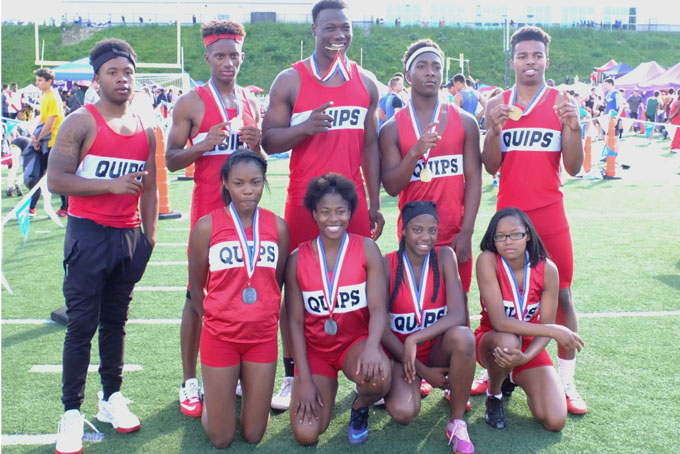 The Aliquippa girls and boys show off their medals, the girls won silver in the AA 400 relay and the boys won gold in the AA 400 relay