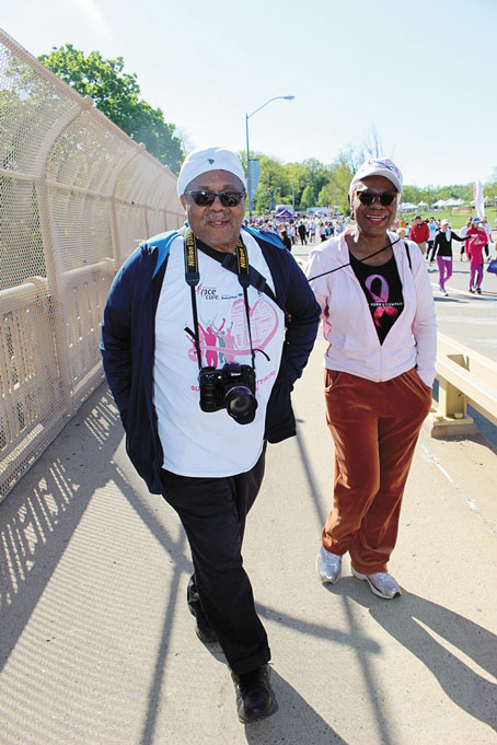 GIVING THEIR SUPPORT—Frank Hightower and Carol Calloway walk in support of those who have passed and who are survivors.