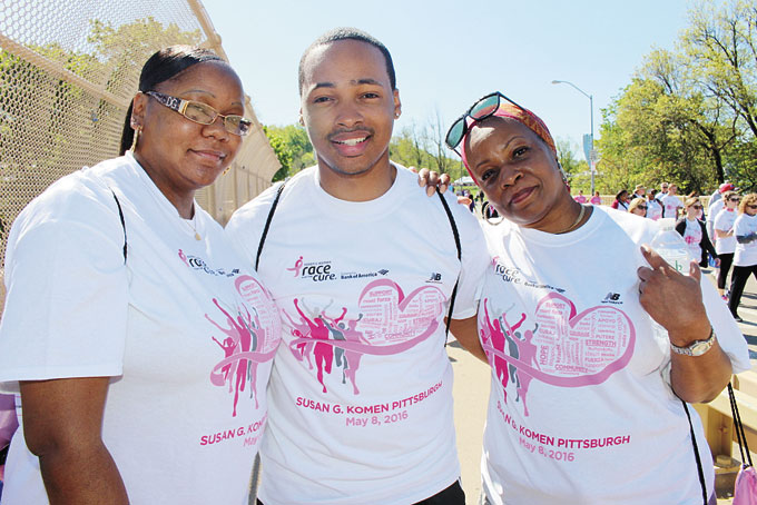 GIVING THEIR SUPPORT—Daniele Martin from Bloomfield, Darryl Loman II, and Willette Loman from Highland Park pose for a photograph after walking through the Race For The Cure. 