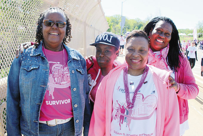 HELEN FRANK a 9-year survivor with from left: Cindy Clark, Charlene Scott, and Margaret Ollison stop to pose for a photo after the race for the cure. 