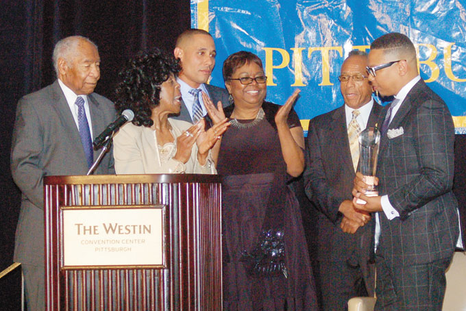 PROUD MOMENT—Congratulations to the chairman from the members of the board. From left: Johnnie Miott, Connie Parker, Morton Stanfield, Gwen Young, Curtis Page and K. Chase Patterson. (Photo by Rossano P. Stewart)