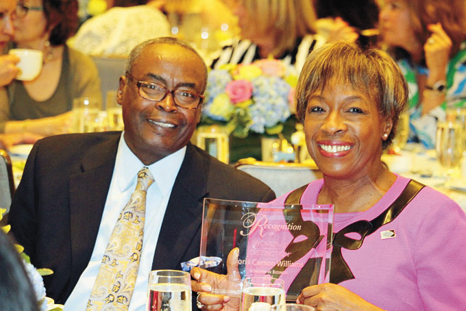 PROUD WINNER—Doris Carson Williams sitting with her husband James Williams at the luncheon after receiving her award. 