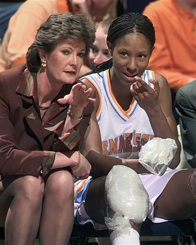 FILE - In this Feb. 26, 1999, file photo, Tennessee head coach Pat Summitt talks with Chamique Holdsclaw on the bench as Holdsclaw ices her knees in the final minutes of their game against Florida at the SEC women's tournament in Chattanooga, Tenn. Summitt, the winningest coach in Division I college basketball history who uplifted the women's game from obscurity to national prominence during her career at Tennessee, died Tuesday morning, June 28, 2016. She was 64. (AP Photo/Mark Humphrey, File)
